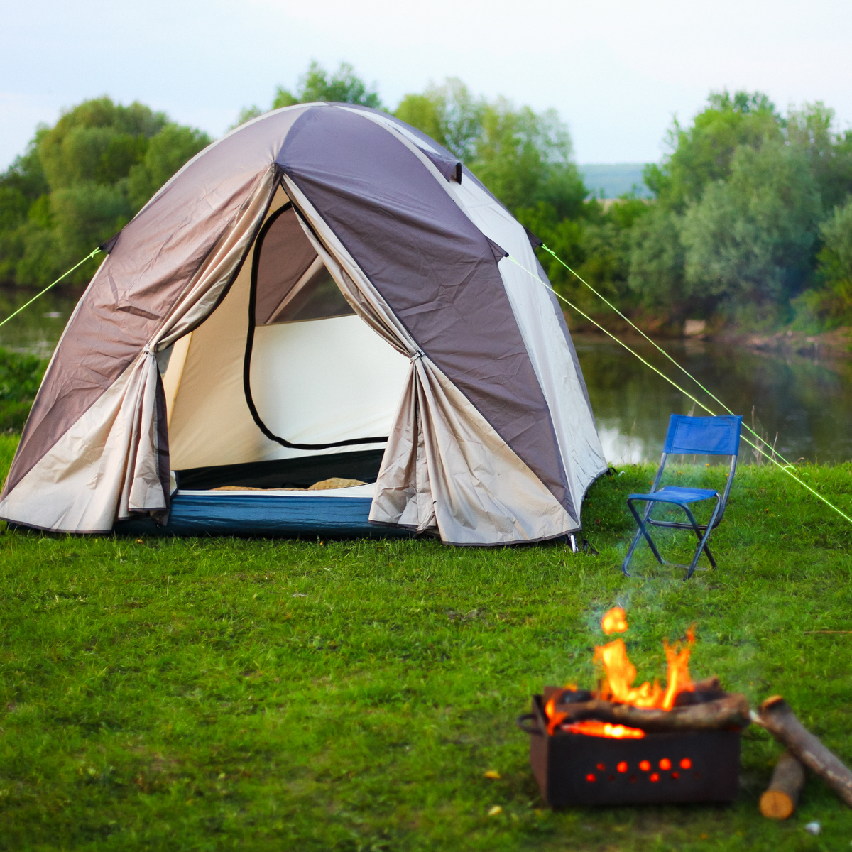 A tent with a beautiful nature view in the background